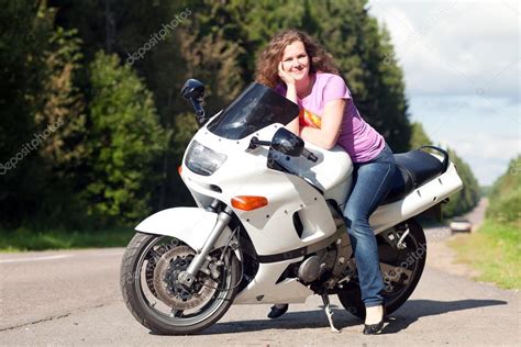 Woman Sitting On A Motorcycle — Stock Photo © Melektaus 38009313