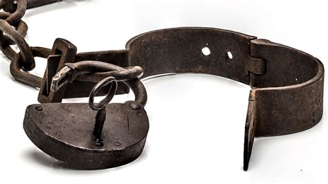 Rusty Old Shackles With Padlock Key And Open Handcuff Used For Locking