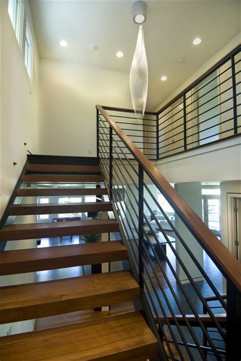 When this is combined with encasing your staircase in crowned oak or factory finished painted panels, the result is a breath taking transformation. Open Modern Stair - Modern - Staircase - Minneapolis - by ...