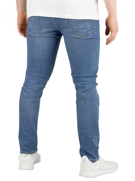 levi s cedar light midtone 519 extreme skinny fit jeans in blue for men lyst