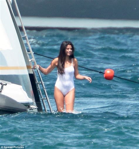 Selena Gomez Looks Stunning In White Bathing Suit As She Splashes Around With Cara Delevingne On