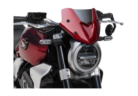 Along with the deep graphite black paint scheme, this edition gets the headlight bezel, windscreen, fork mounts, radiator shrouds finished in black. HONDA CB1000R 2018 Sportsline headlight cover - ABS plastics