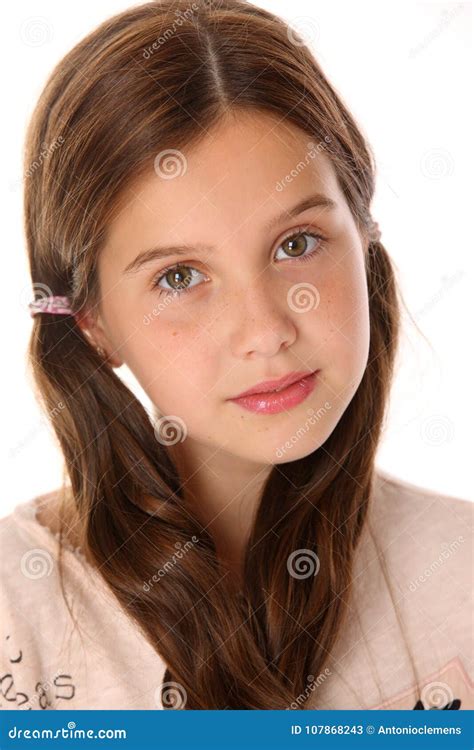 Adorable Preteen Girl With A Blank Clipboard Stock Photo