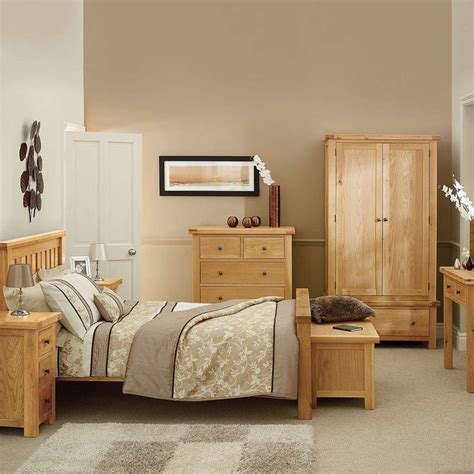 The orange shelf at the foot of the bed brightens up this otherwise neutral room. Basics of Solid Oak Bedroom Furniture