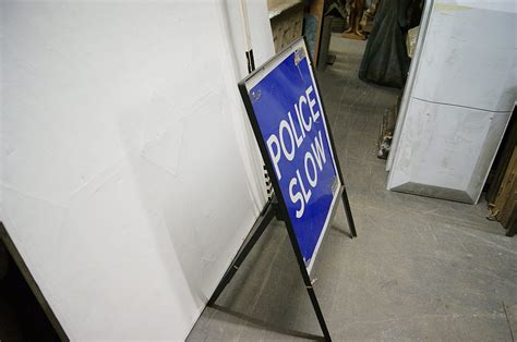 0771073 Police Slow Sign Folding H 110cm X 77 X 1 Off Stockyard Prop And Backdrop Hire