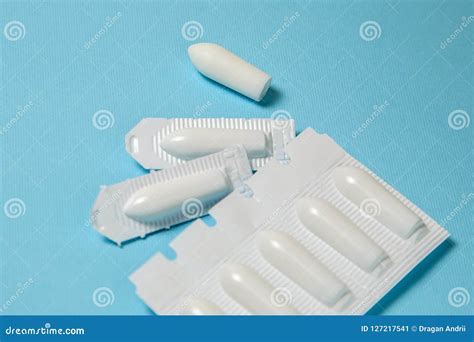 Suppository For Anal Or Vaginal Use On A Blue Background Candles For Treatment Of Hemorrhoids