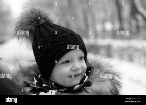 Funny Laughing Baby In Winter Outside Cute Toddler Kid In A Warm