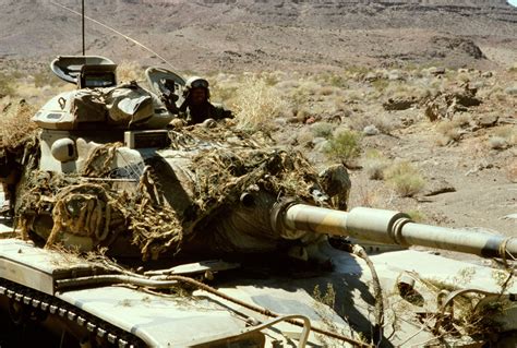 A Marine Aboard An M 60a1 Tank Participates In Combat Exercises During