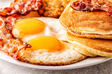 Healthy Full American Breakfast With Eggs Bacon Pancakes And Latkes