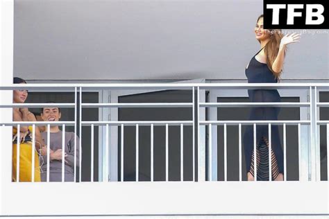 Chrissy Teigen John Legend Kiss And Pose During An Impromptu Balcony Shoot Photos