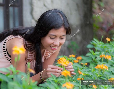 Young Woman Picking Flowers In Garden — Outdoors Focus On Foreground
