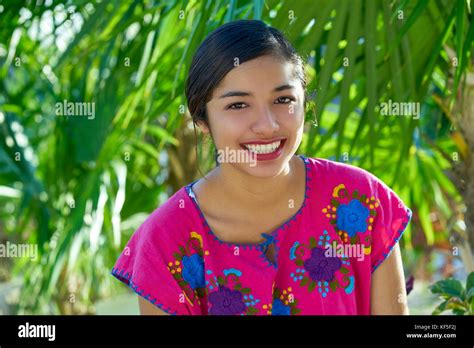 Mexican Latin Woman With Mayan Dress Smiling In The Jungle Stock Photo