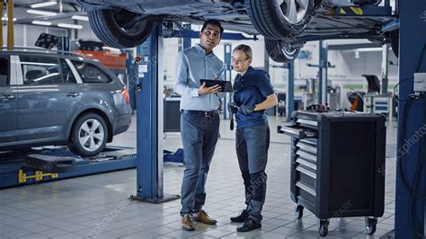 Mechanic And Service Manager Inspecting A Car Stock Image F0331280