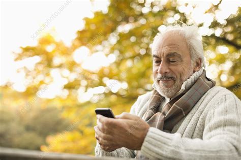 Older Man Using Cell Phone Outdoors Stock Image F0137613 Science Photo Library