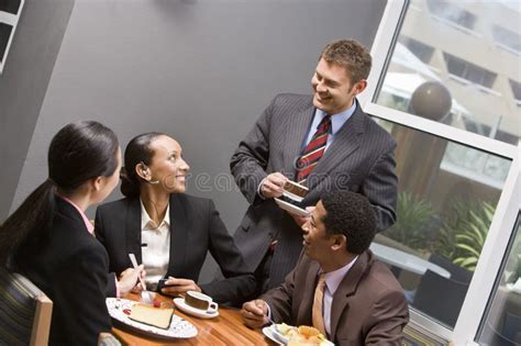 Business People Having Discussion During Their Break Stock Photo