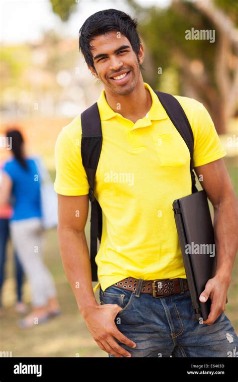 Handsome Male Indian University Student Standing Outdoors On Campus