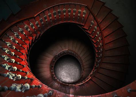It's a perfect addition for those who love a fashionable look and feel. Spiral staircase in red tones Photograph by Jaroslaw Blaminsky