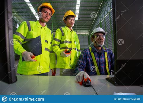 Asian Supervisor Engineer Consult With Warehouse Workers, Inside The ...