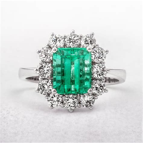 218ct Emerald And 1ct Diamond Cluster Ring