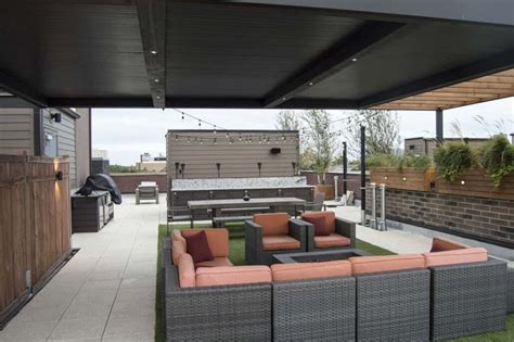 rooftop entertaining deck featuring pergola lounge and dining area uptown chicago urban