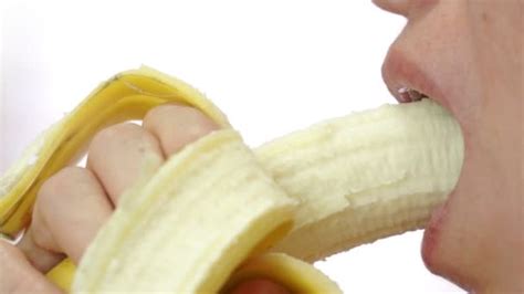 Female Eating A Healthy Banana Closeup — Stock Video © Cactii 55276253