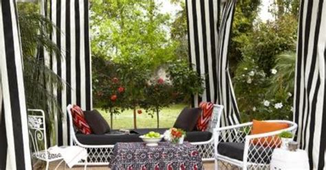 Black And White Striped Curtains Give The Patio A Cabana