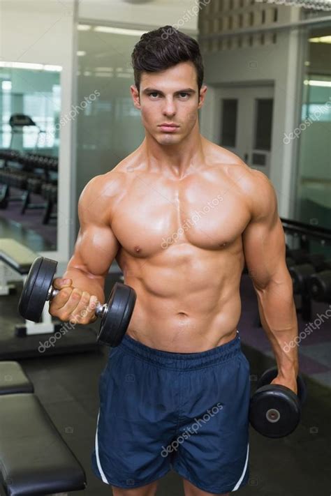 Shirtless Muscular Man Exercising With Dumbbells Stock Photo By