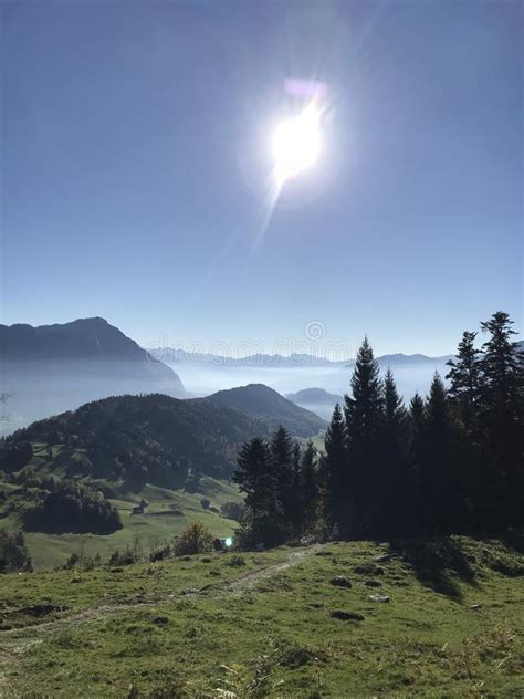 Mountain Panorama With Different Layers And Blue Sky At Buergenstock In