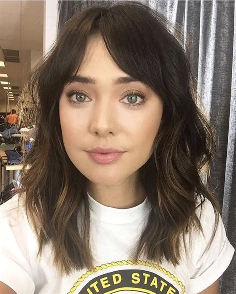 Showing that you don't need super long hair to rock the curtain hair trend, this brunette's lob gives the look a. Medium length hair with bangs @loganstanton | Medium ...