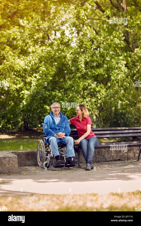 Spending Time Together Cheerful Daughter With Her Disabled Father In