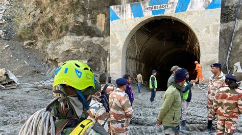 india rescuers try to reach workers trapped in tunnel as relatives push for answers over deadly