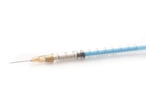 Free Image Of Small Syringe Filled With Dose Of Medication