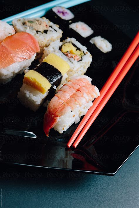 Sushi And Chopsticks On Black By Stocksy Contributor Paul Phillips