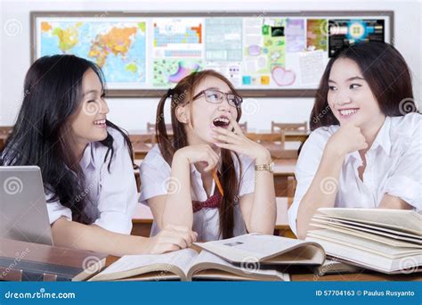 Three Learners Studying And Laughing In The Class Stock Image Image