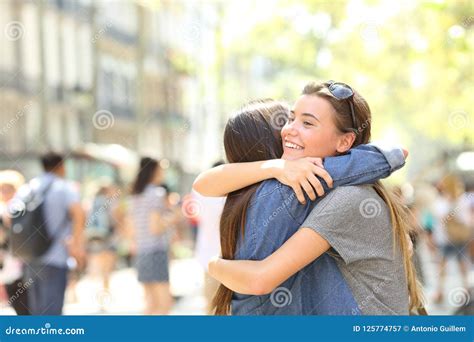 Friends Hug In The Street Stock Image Image Of Adults 125774757