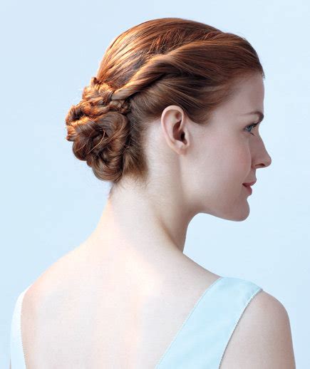 It elevates your everyday bun, making it a flirty choice for work and special occasions, alike. Flower Bun | 6 Easy Braided Hairstyles - Real Simple