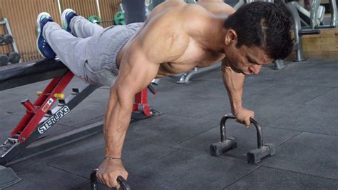 Pushups With Elevated Feet Using Pushup Bars Learn How To Do This