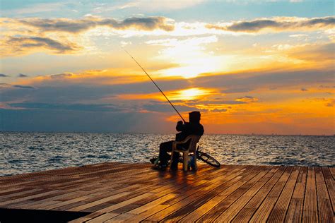 Free Photo Of Man Fishing Sunset