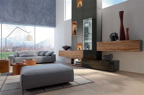 Wood and metal accessories and wood floor shine in this layout. Minimalist living room with gray sofa - Interior Design Ideas