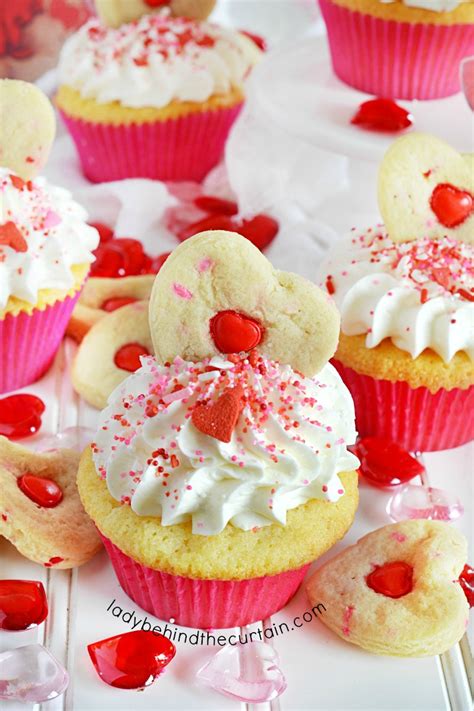 Food & wine's best valentine's day cupcake recipes and tips include how to make swirled cupcake frosting, where to find america's best cupcakes and a guide to filling cupcakes. Strawberry Cream Filled Valentine's Day Party Cupcakes