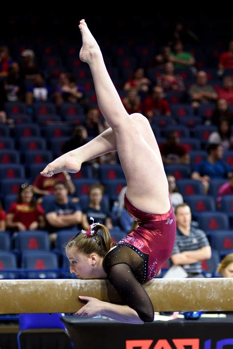 9th fig aerobic gymnastics world age group competitions. University of Denver gymnast Leah Lomonte mounts the beam ...