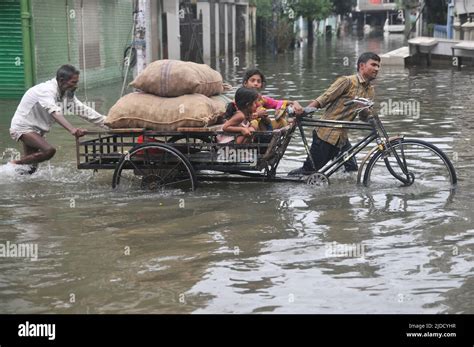 Sylhet, Bangladesh. 20th June 2022. Children traveling in a cart during