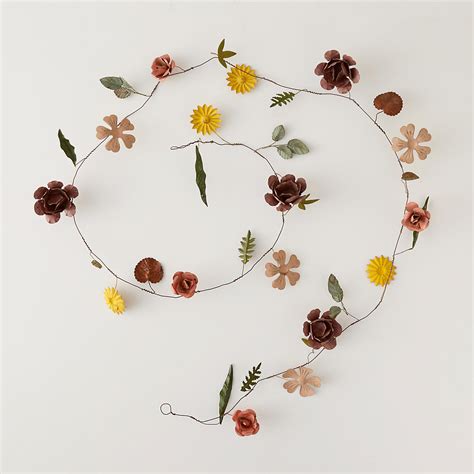 This is a great tool to help you keep stems in place underwater while adding more accent color to your vase! Pressed Metal Flower Garland | Terrain