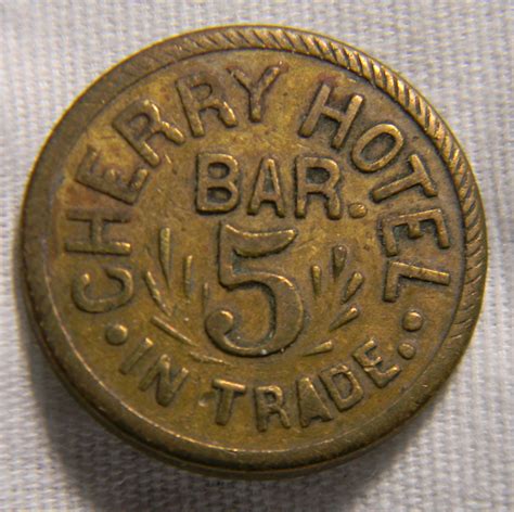 All the bar token holders would be able to use chat, trade assets and play decentralized games. please help identify Cherry Hotel Bar Token - Numista