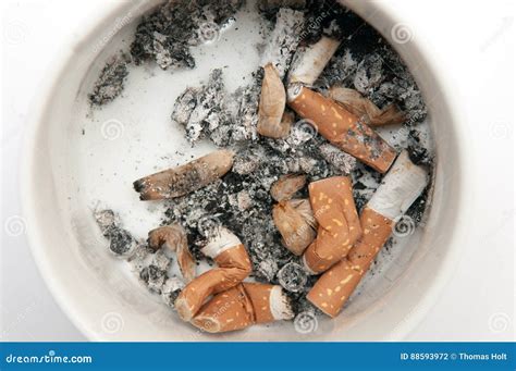 Ashtray Full Ashtray Of Smoked Cigarettes Isolated On White Stock