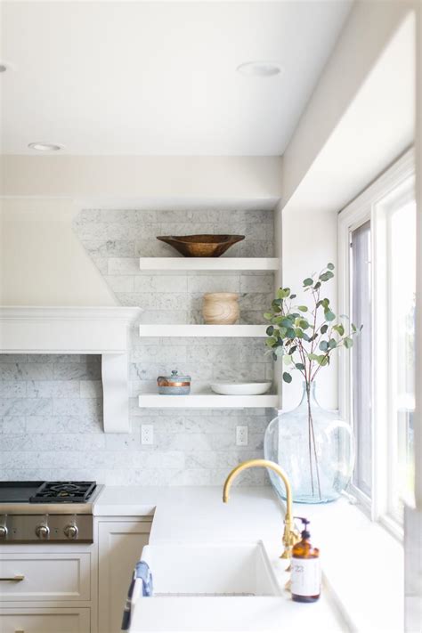 Contemporary Kitchen With White Marble Tile Backsplash And