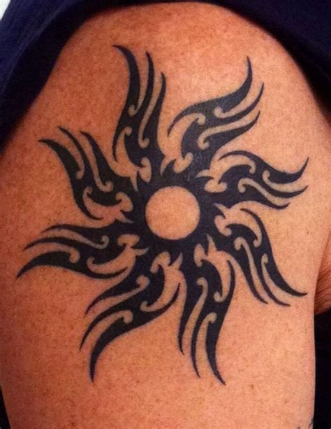 Black Tribal Sun Tattoo On Shoulder Tattoomagz › Tattoo Designs
