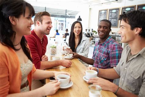 Group Of Friends Meeting In Coffee Shop Stock Image Image Of Drinking