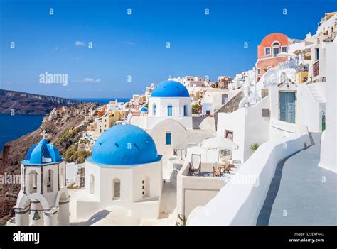 White Houses And Blue Domes In The Village Of Oia Santorini Thira