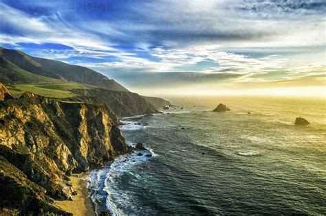 The Coastline At Big Sur In California With Steep Cliffs And Rock